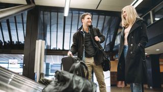 Travelers at Baggage Claim