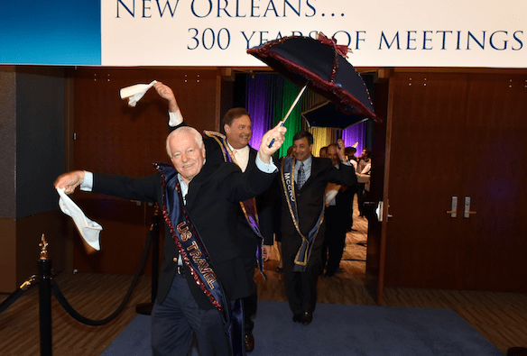 U.S. Travel Association President and CEO Roger Dow participating in a 'second line' at the New Orleans Morial Convention Center. 